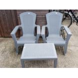 2 plastic garden armchairs with matching side tabl