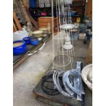 Pair of tall metal plant stands along with a 3 tie