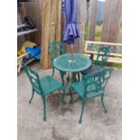 Wrought iron garden table, 4 chairs & parasol