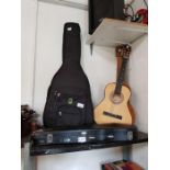 3 acoustic guitars, a guitar case, and a cased vio