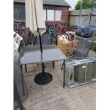 Metal framed garden table with glass top along wit