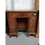 Reproduction kneehole desk with leather top