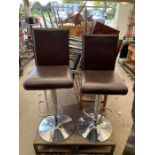Pair of chrome and leatherette bar stools