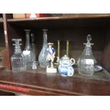 Various glass decanters, brass candlesticks & cera