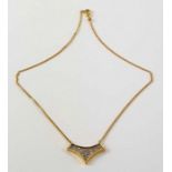 A diamond set necklet, the V shaped centre set wit