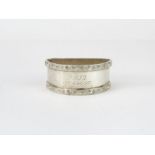 A silver Lindisfarne pattern napkin ring, of D sha