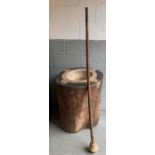 A very large pestle and mortar, the mortar cased i