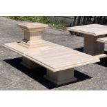 A pair of white marble coffee tables, along with a