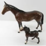 A Beswick figure of a bay horse, 20cm high; togeth