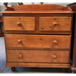 A 20th century pine chest of drawers, with back ra