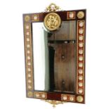 A 20th century mahogany mirror, the border set wit