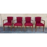 A collection of four beech framed lounge armchairs