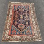 A 20th century decorative rug, with a repeated cen