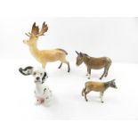 Four Beswick figures - a stag, a donkey, a calf an