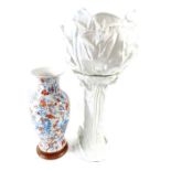 A 20th century white ceramic flower vase on stand,