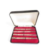 A set of four silver card or games pencils, cased