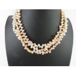 A three strand cultured freshwater pearl necklace,