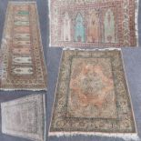 A collection of four silk 20th century rugs,