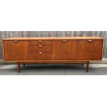 A mid century Austin Suite teak sideboard, two doo