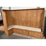 A Victorian pine settle, with a curved end, two sh