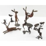 A bronze figure of boxing hares, 11.5cm high max;