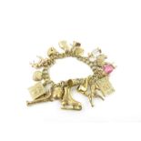 A 9ct gold double link charm bracelet, with variou