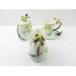 A Graff Porcelain tea cup and saucer, a jug and a