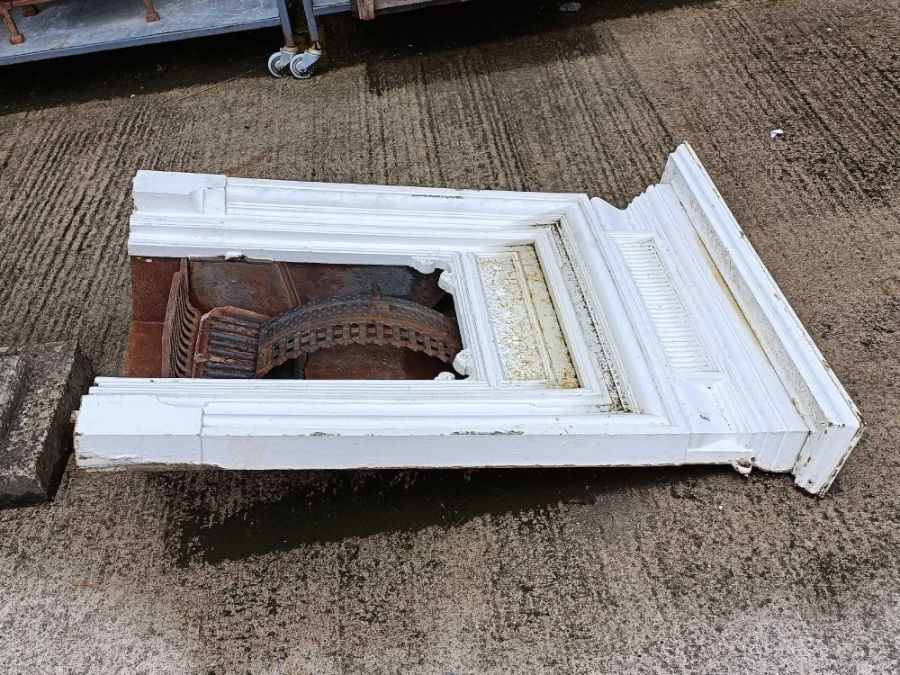 Victorian white painted fireplace along with a cas