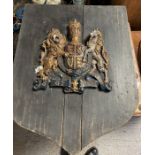 A plaster plaque of the Royal Coat of Arms