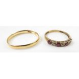 A ruby and diamond half eternity ring, marked '375