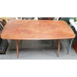 A mid century Ercol beech and elm dining table, 72