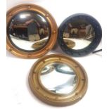 Three 20th century gilded porthole mirrors