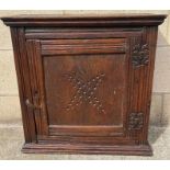 A 19th century oak wall hanging cupboard, with