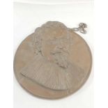 A 20th century circular bronze hanging plaque of C