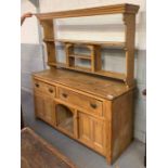 A Victorian two section pine dresser, with two