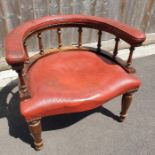 A 20th century desk chair, upholstered in a red le