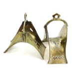 A pair of moorish design brass stirrups