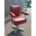 A 20th century chromed barbers chair, upholstered