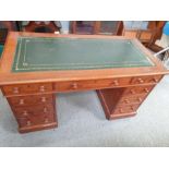 A 20th century mahogany twin pedestal desk, with a