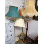 4 standard lamps, 1 wooden, 2 brass, 1 other, all w