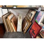 Shelf of framed pictures, paintings and canvases