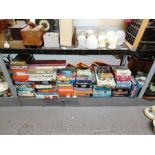 Shelf of jigsaw puzzles, board games to include Pa