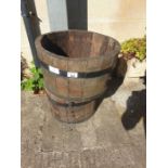 2 wooden barrel planters