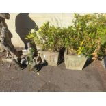 2 square stone planters with plants
