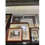 Shelf of framed pictures