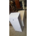 White pine bathroom cabinet along with a white