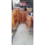 Pine kitchen shelving unit along with a pine bookc
