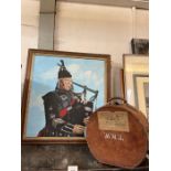 Framed painting of a bagpipe player and a hat box