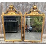 A pair of 20th century Adams style mirrors each in