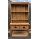 A Victorian two section pine dresser, with single
